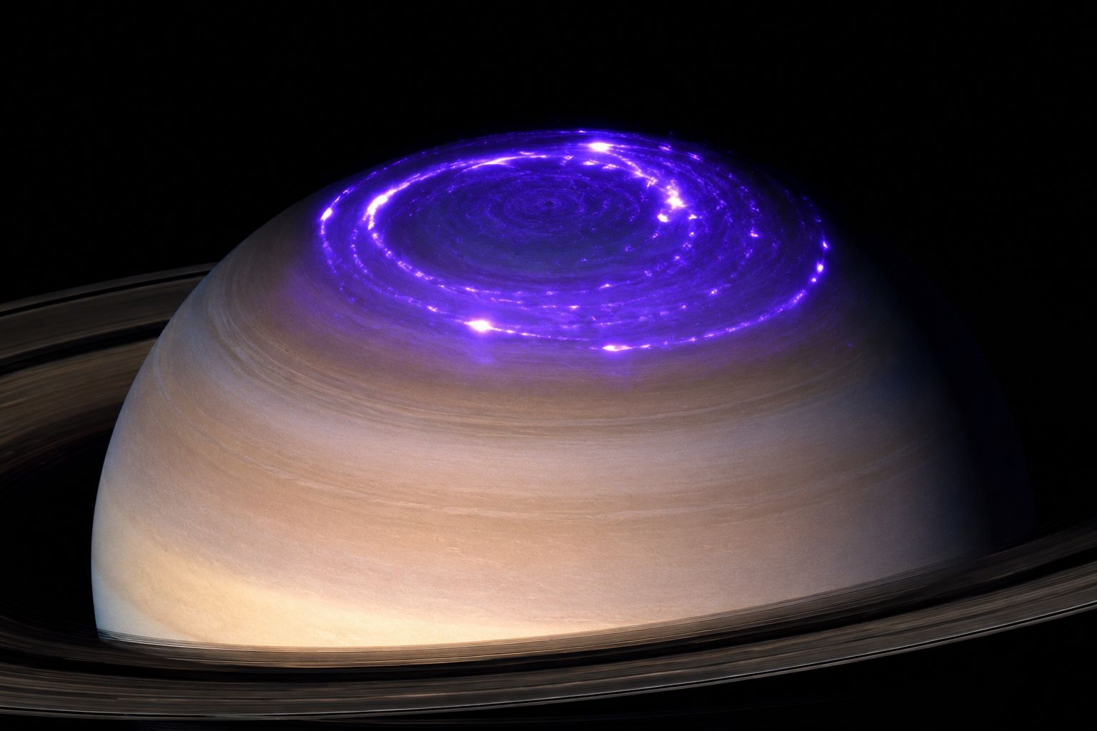 Saturn's aurora glowing at the north pole, captured in ultraviolet light by Hubble