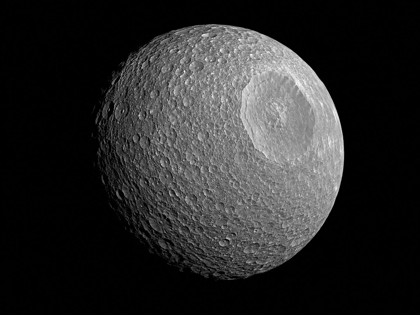 Saturn's moon Mimas showing the enormous Herschel crater that makes it look like the Death Star