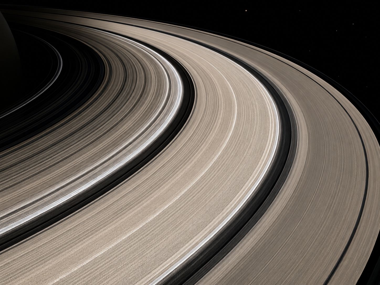 Close-up of Saturn's rings showing distinct bands of icy material, photographed by Cassini