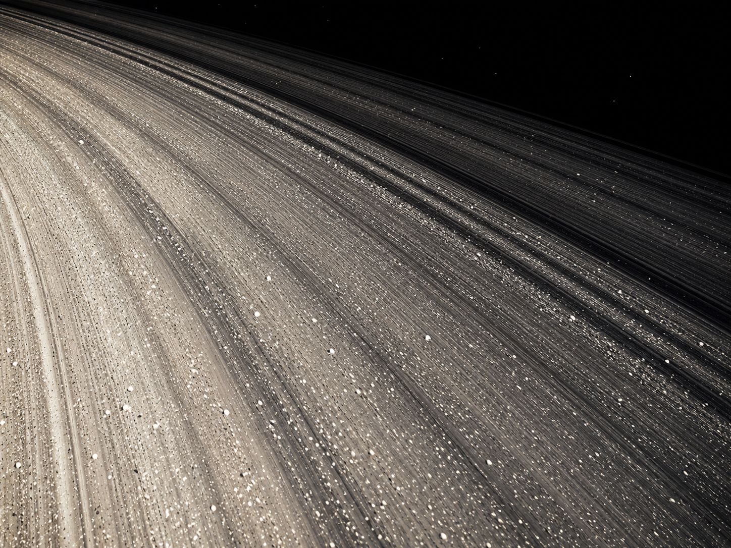 Close-up of Saturn's rings showing the texture of icy particles that make up the ring material