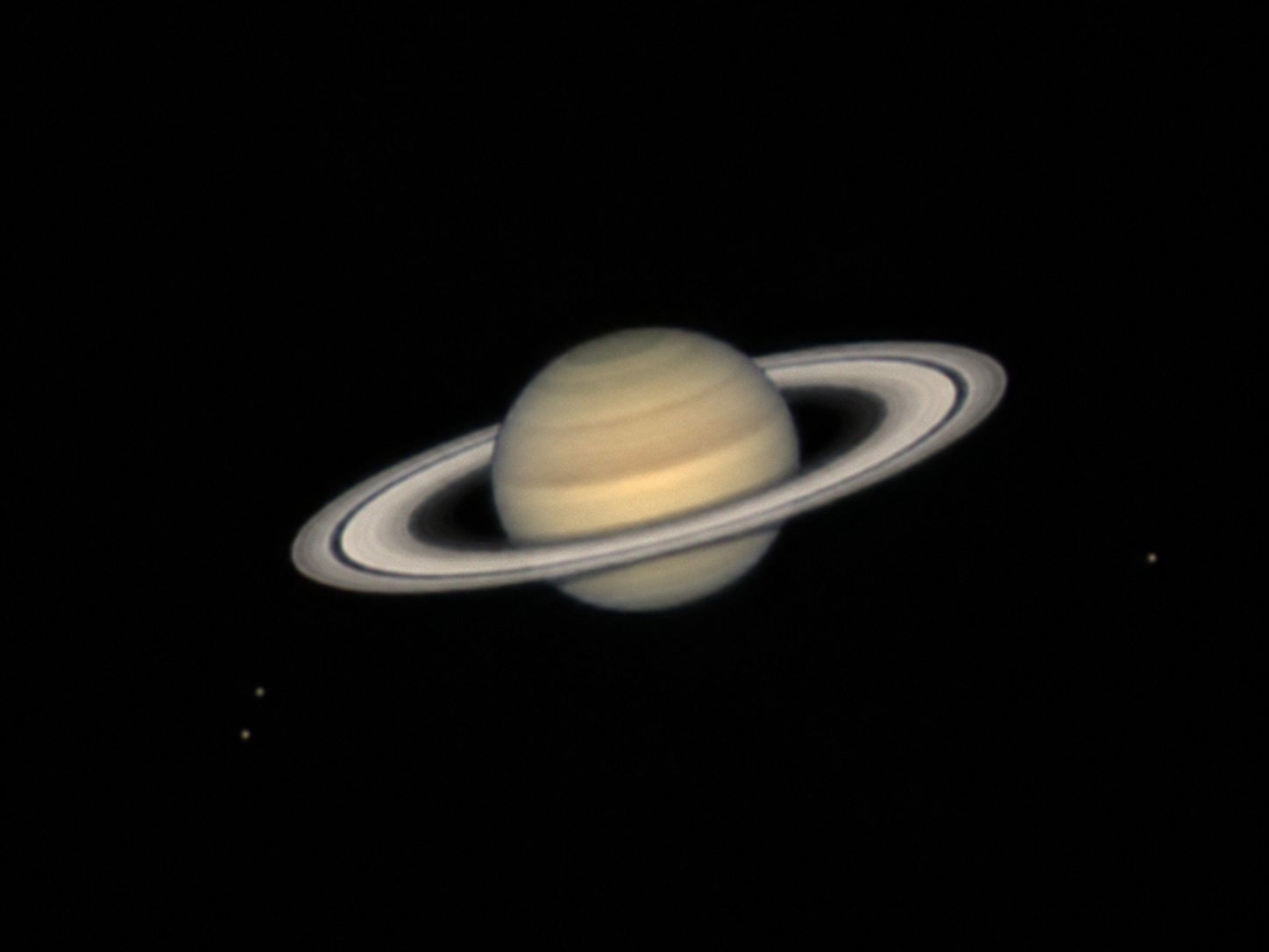 Saturn as seen through a back-garden telescope, showing the planet and its bright rings