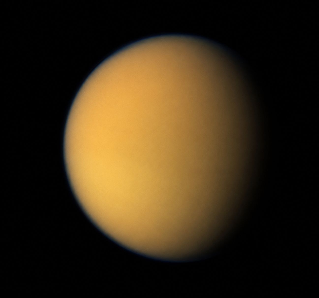 Saturn's moon Titan as photographed by NASA's Voyager 1 spacecraft in 1980, showing its thick orange atmosphere