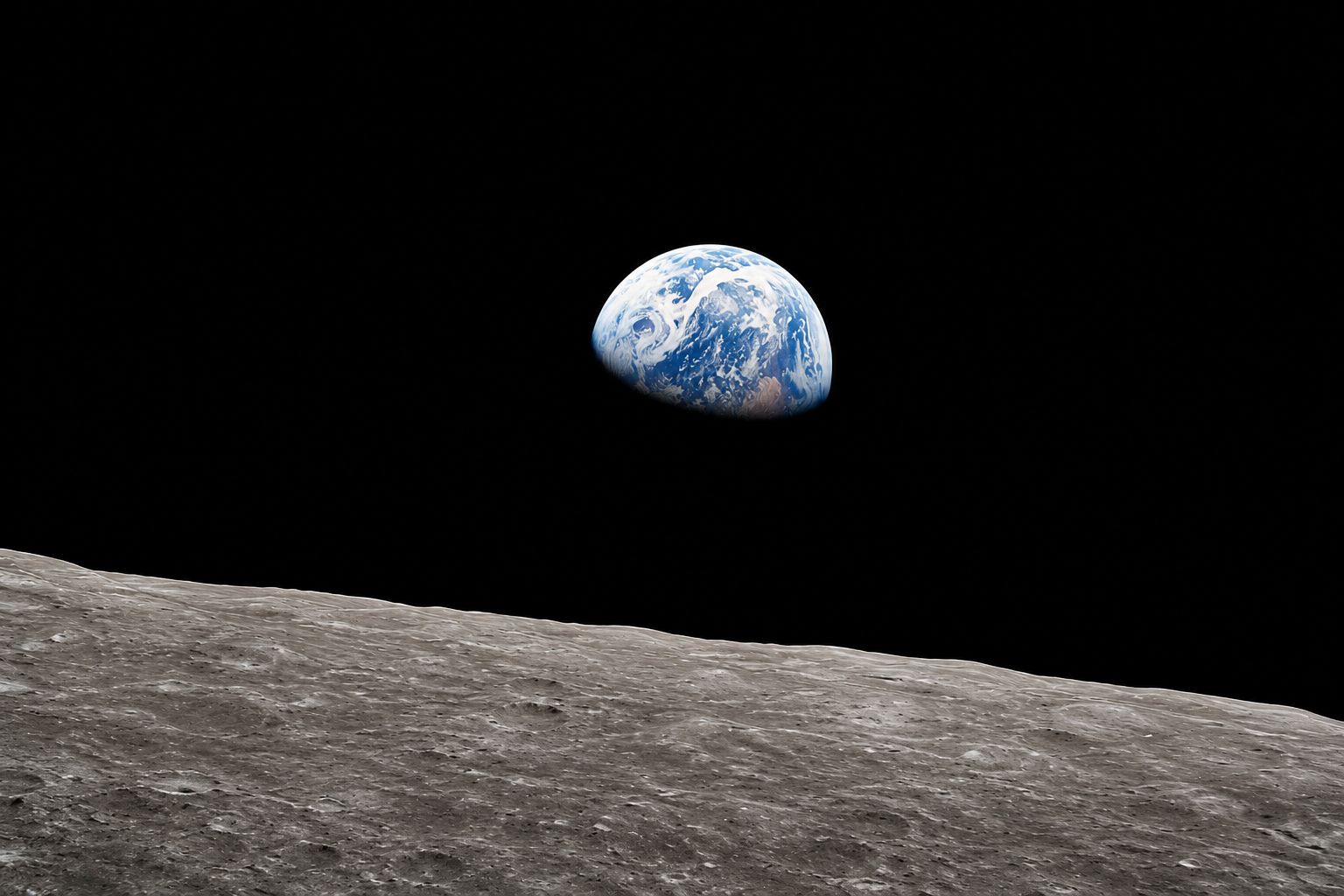 The Earth rising over the lunar horizon, photographed by Apollo 8 astronaut Bill Anders on Christmas Eve, 1968